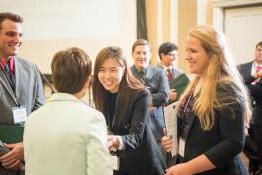 faculty and students talking